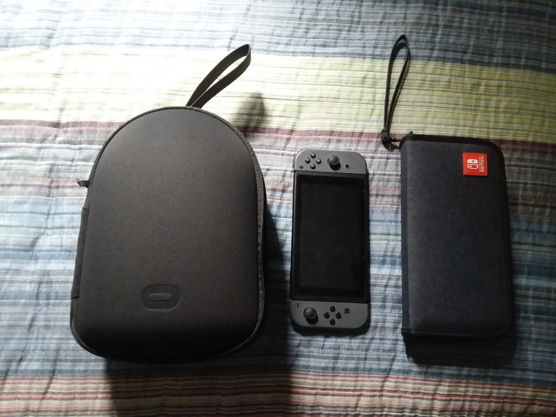 The Oculus Quest official carrying case, a Nintendo Switch, and a Switch carrying case for a side-by-side comparison